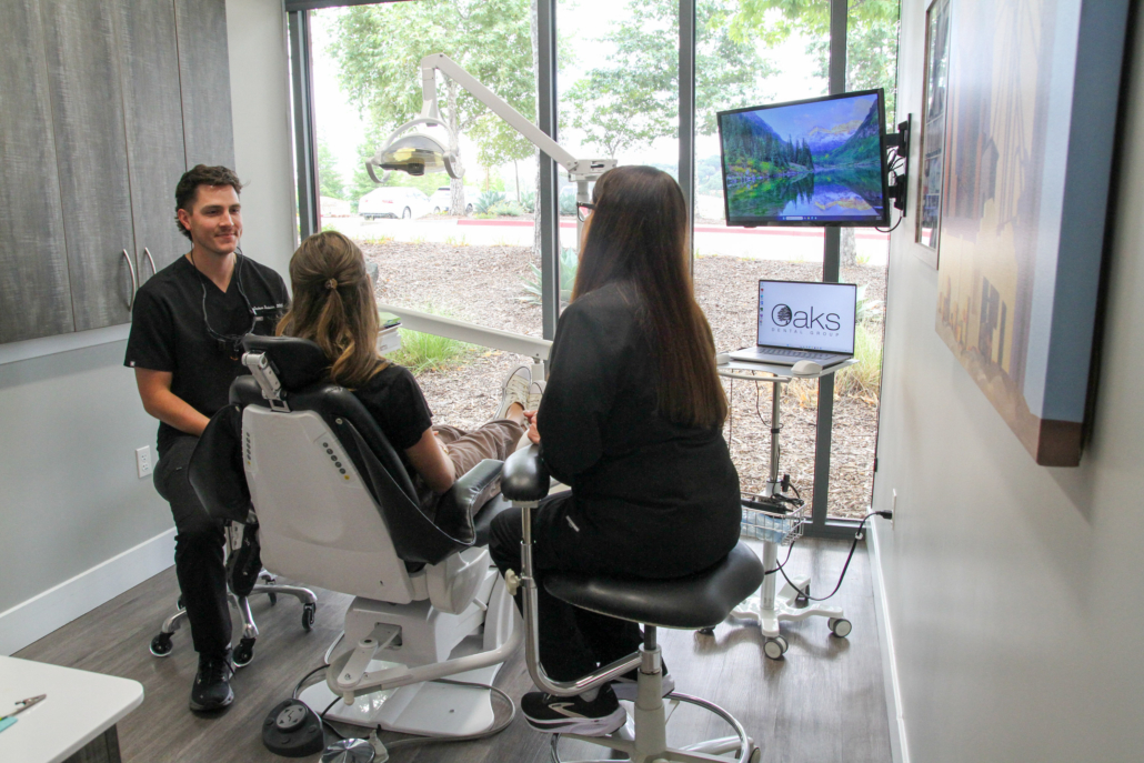 Oaks Dental | Dr Graham with patient